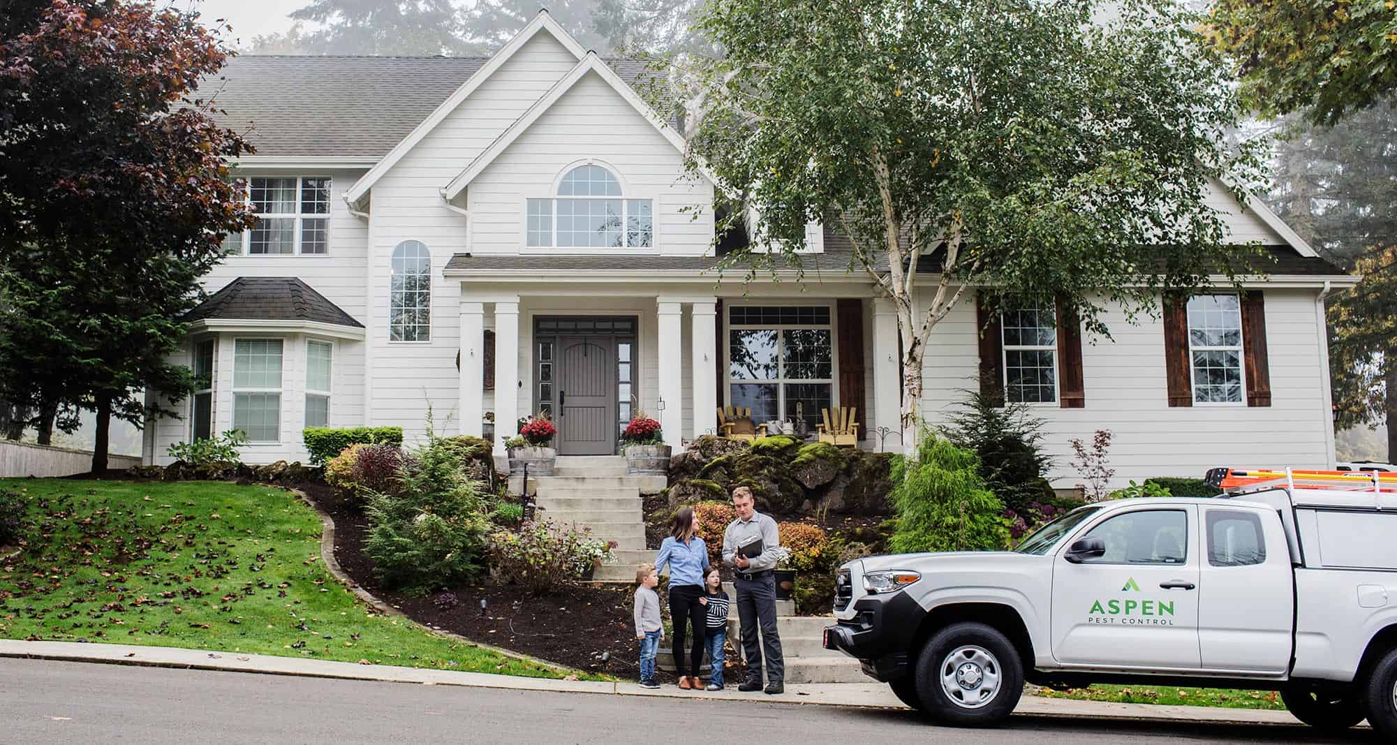 photo of oregon city pest control truck in front of client house